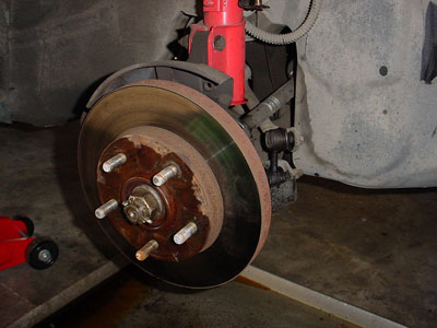Spray WD-40 on rusted brake rotor